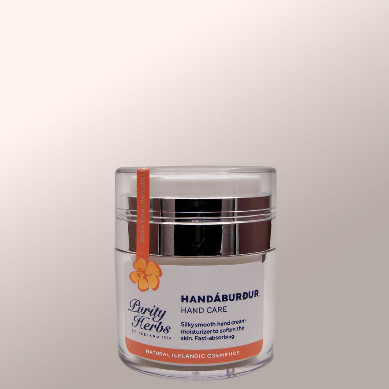 Hand cream jar labeled 'Purity Herbs' on a light gray background